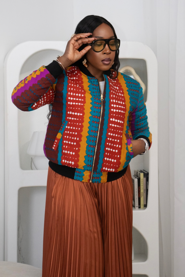 Reversible African Print Bomber Jacket with Black Viscose on the inner reverse | African print Biker Jacket | Ankara print Bomber Jacket | African Print Outerwear | African Winter style for women | sustainable African Fashion | recycled African print clothing | Ethically sourced fashion | ethically sourced clothing | handmade clothing | African clothing for women | Ankara jacket | Tribal prints kimono | Floral African print clothing | Cotton Blazer | African print workwear | African clothing UK