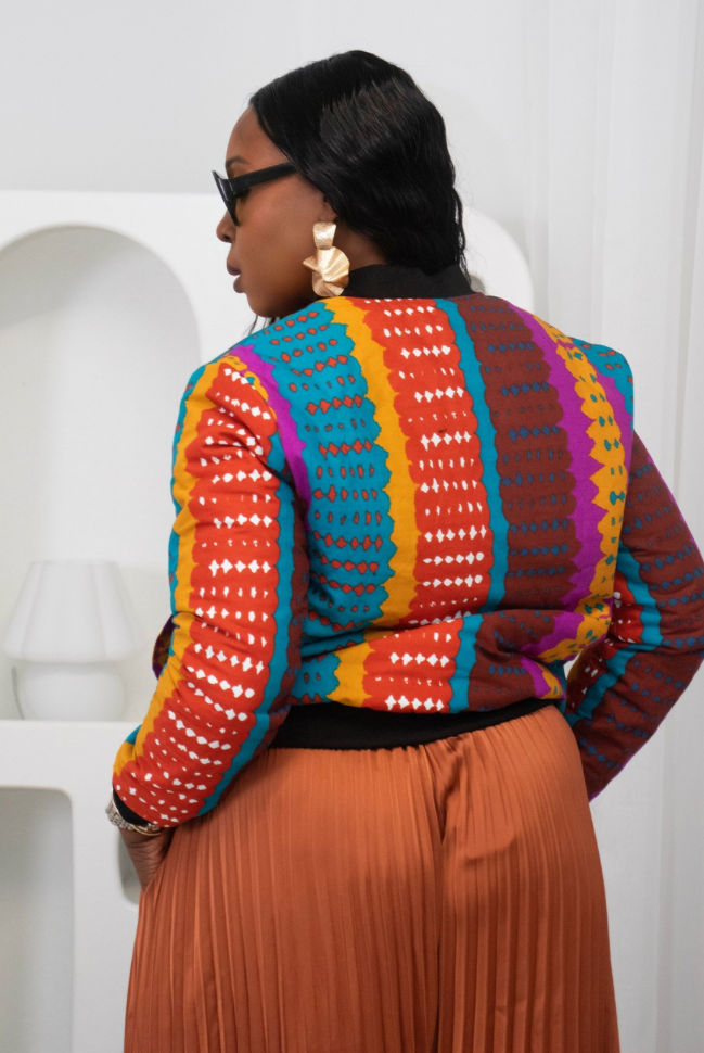 Reversible African Print Bomber Jacket with Black Viscose on the inner reverse | African print Biker Jacket | Ankara print Bomber Jacket | African Print Outerwear | African Winter style for women | sustainable African Fashion | recycled African print clothing | Ethically sourced fashion | ethically sourced clothing | handmade clothing | African clothing for women | Ankara jacket | Tribal prints kimono | Floral African print clothing | Cotton Blazer | African print workwear | African clothing UK