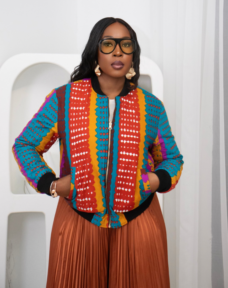 Reversible African Print Bomber Jacket with Black Viscose on the inner reverse | African print Biker Jacket | Ankara print Bomber Jacket | African Print Outerwear | African Winter style for women | sustainable African Fashion | recycled African print clothing | Ethically sourced fashion | ethically sourced clothing | handmade clothing | African clothing for women | Ankara jacket | Tribal prints kimono | Floral African print clothing | Cotton Blazer | African print workwear | African clothing UK