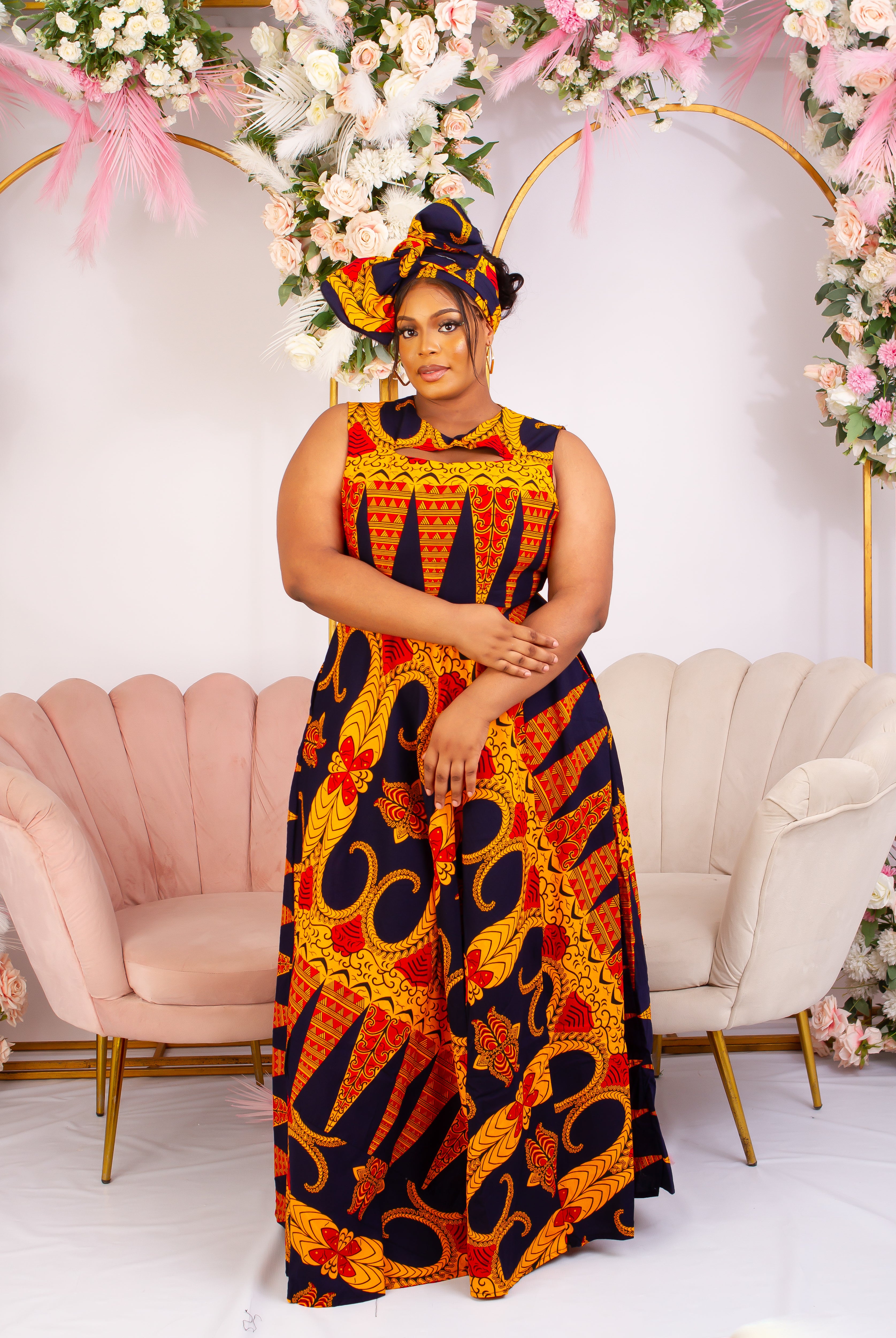 Vibrant Yellow and Navy Blue African Print flare maxi dress perfect for a special occasion. Sleeveless with bust cut out for an edgy and chic look. Shop Ghana African print dress | African maxi dresses | African print gown | African Clothing Online  Shop | Maxi African dress |  African women's clothing  | kitenge dresses | Africa Dresses for Women | African dresses for wedding | Danshiki Dress | Trendy African Dress | African clothing UK