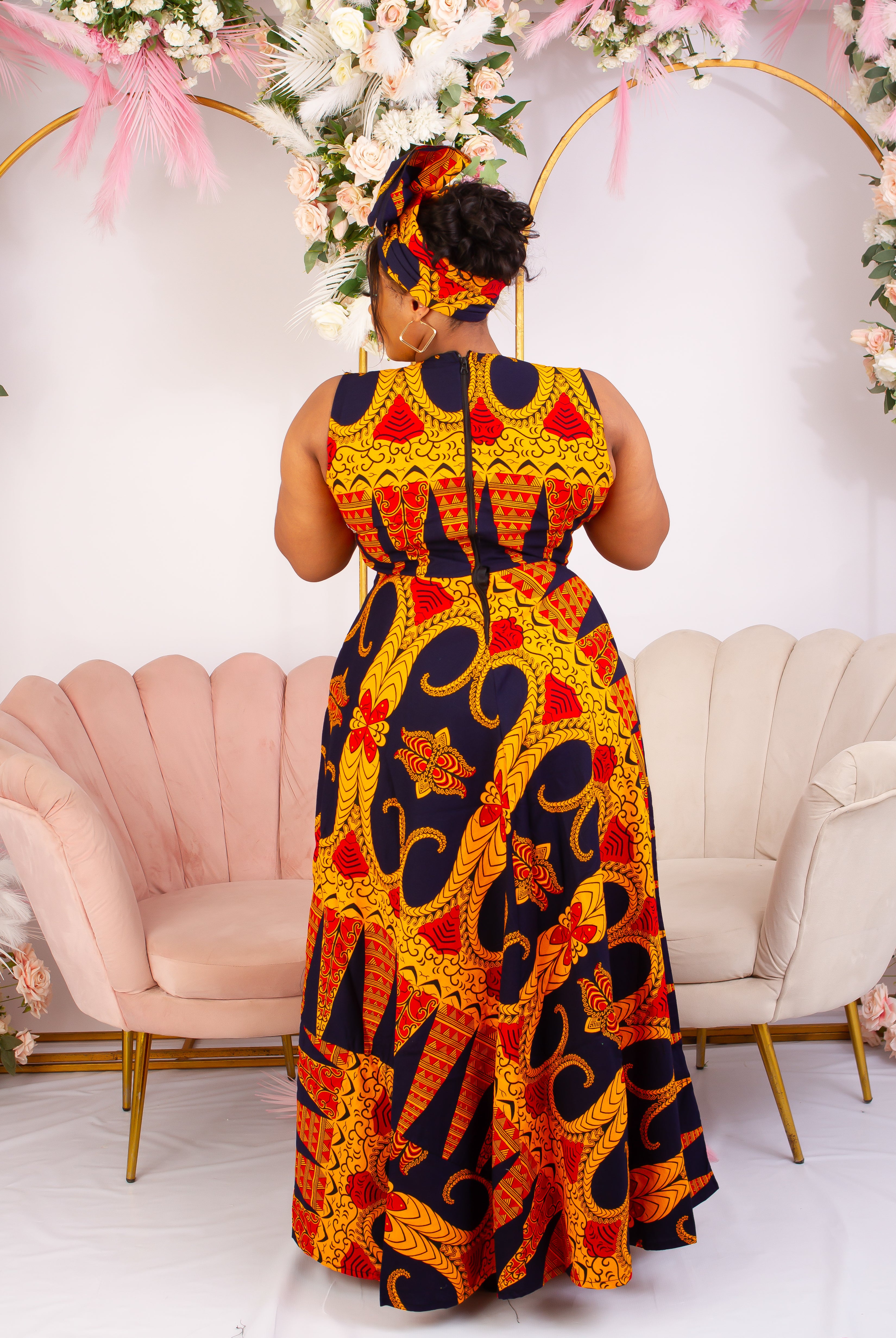Vibrant Yellow and Navy Blue African Print flare maxi dress perfect for a special occasion. Sleeveless with bust cut out for an edgy and chic look. Shop Ghana African print dress | African maxi dresses | African print gown | African Clothing Online  Shop | Maxi African dress |  African women's clothing  | kitenge dresses | Africa Dresses for Women | African dresses for wedding | Danshiki Dress | Trendy African Dress | African clothing UK