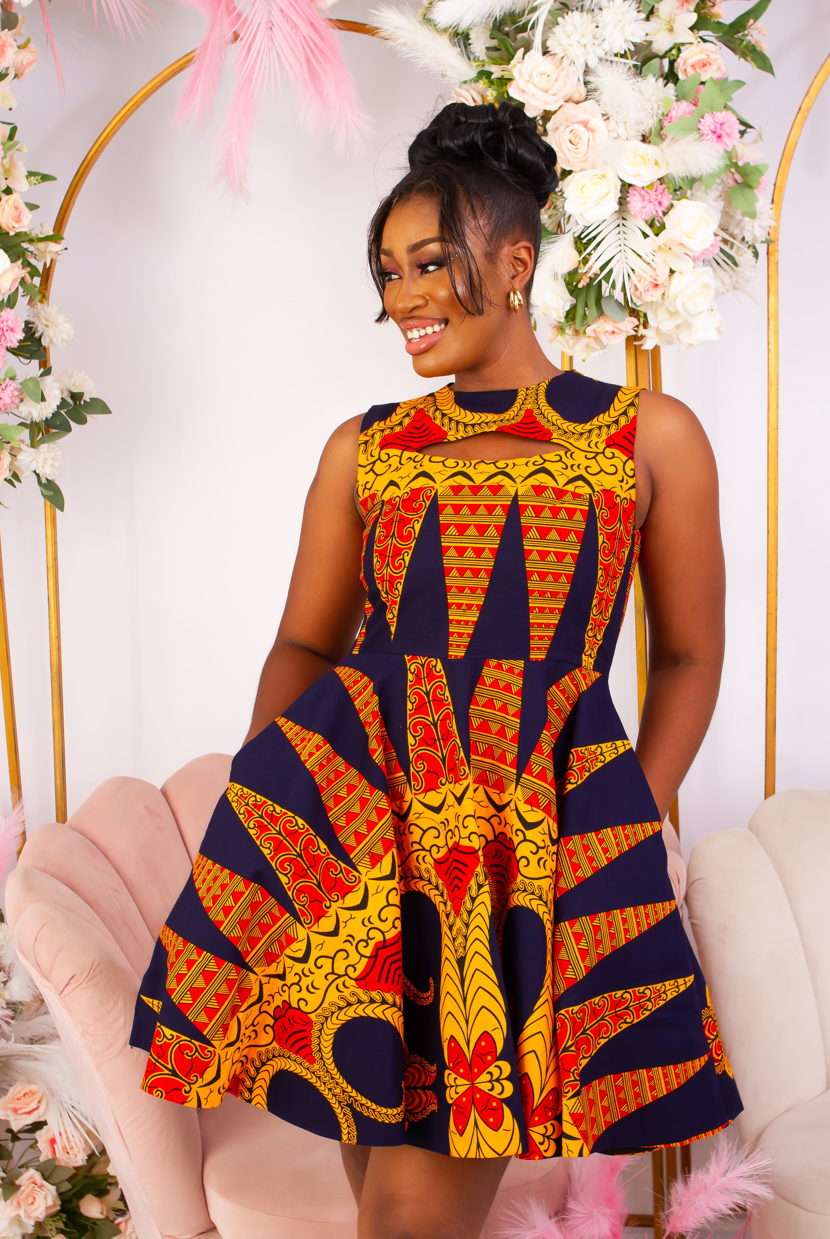 Vibrant Yellow and Navy Blue African Print flare mini dress perfect for a special occasion. Sleeveless with bust cut out for an edgy and chic look. Shop Ghana African print dress | African short dresses | African print gown | African Clothing Online Shop | Maxi African dress | African women's clothing | kitenge dresses | Africa Dresses for Women | African dresses for wedding | Danshiki Dress | Trendy African Dress | African clothing UK