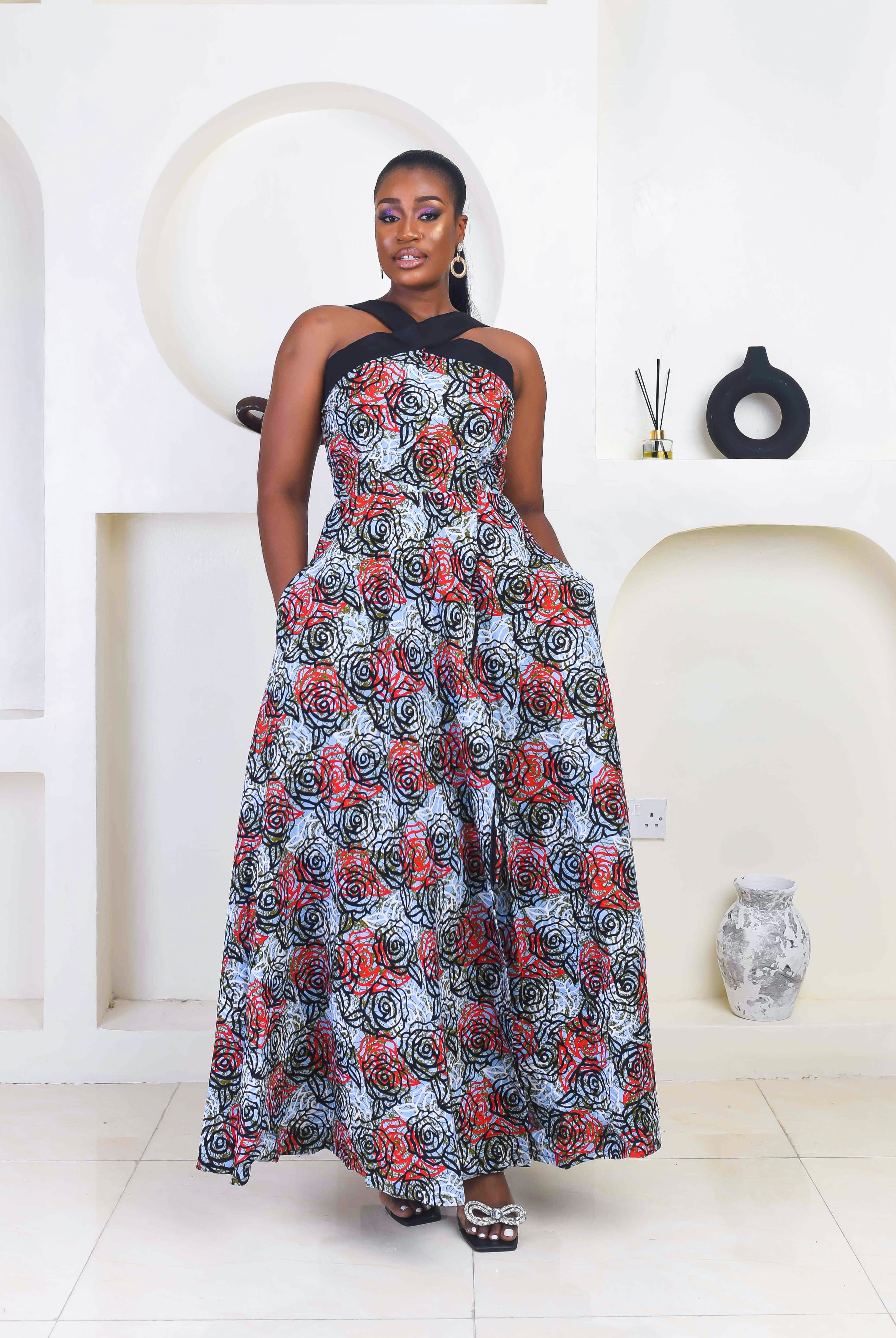 Vibrant Yellow and Navy Blue African Print flare maxi dress perfect for a special occasion. Sleeveless with bust cut out for an edgy and chic look. Shop Ghana African print dress | African maxi dresses | African print gown | African Clothing Online Shop | Maxi African dress | African women's clothing | kitenge dresses | Africa Dresses for Women | African dresses for wedding | Danshiki Dress | Trendy African Dress | African clothing UK