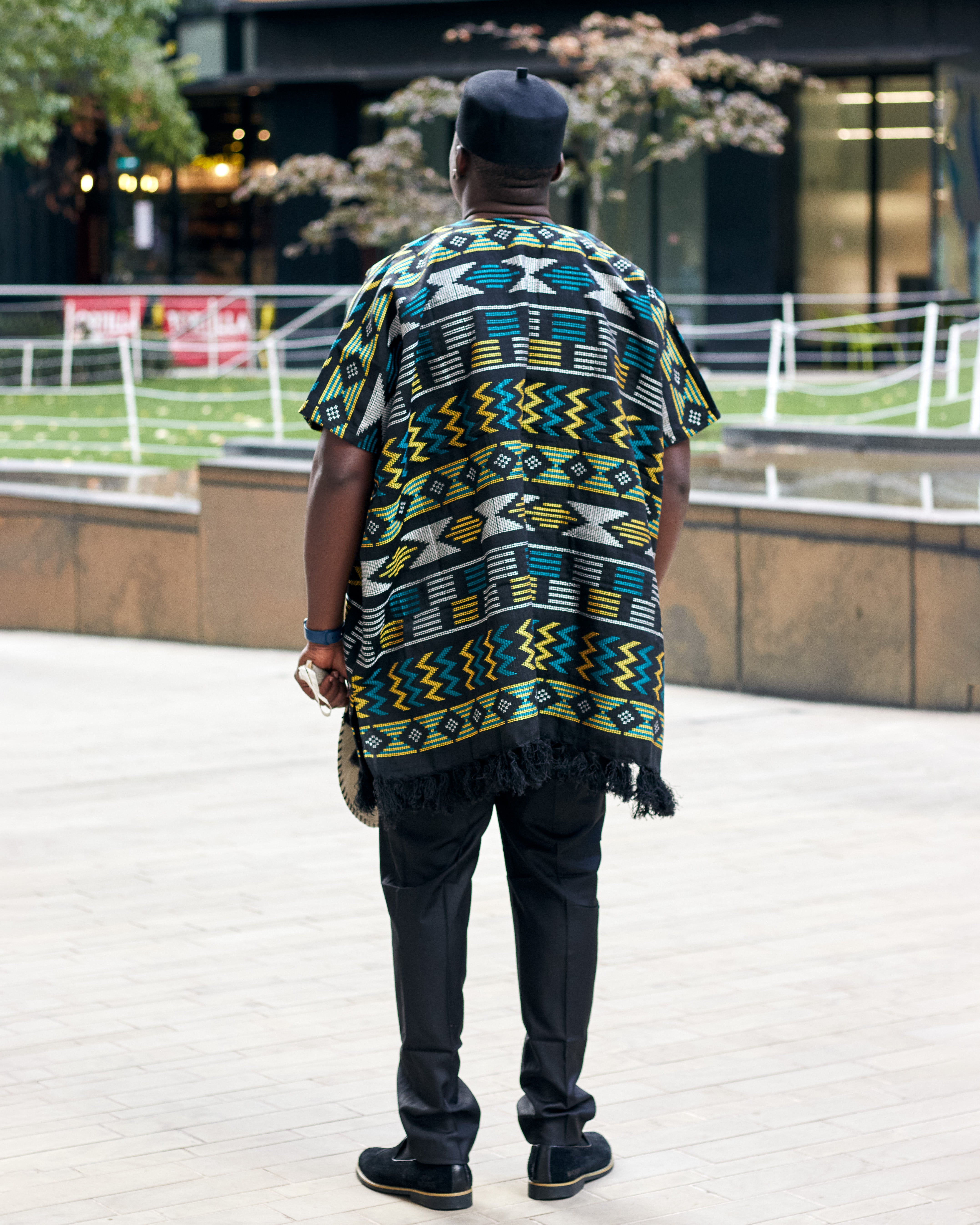 Back view of Model wearing men’s Akwete kaftans in rich woven designs, perfect for weddings, cultural events, and stylish traditional African menswear.
