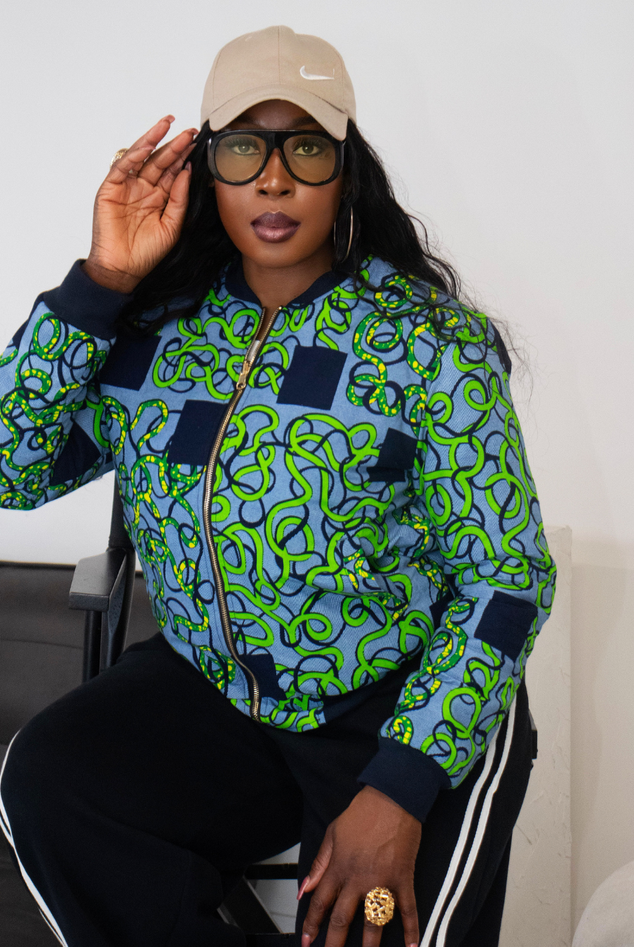 Reversible African Print Bomber Jacket with Denim on the inner reverse | African print Biker Jacket | Ankara print Bomber Jacket | African Print Outerwear | African Winter style for women | sustainable African Fashion | recycled African print clothing | Ethically sourced fashion | ethically sourced clothing | handmade clothing | African clothing for women | Ankara jacket | Tribal prints kimono | Floral African print clothing | Cotton Blazer | African print workwear | African clothing UK