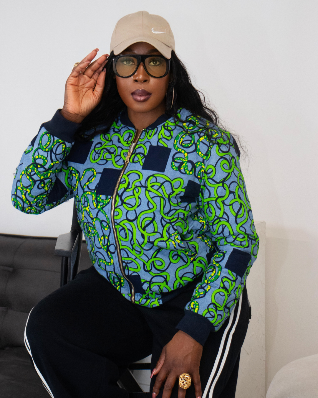 Reversible African Print Bomber Jacket with Denim on the inner reverse | African print Biker Jacket | Ankara print Bomber Jacket | African Print Outerwear | African Winter style for women | sustainable African Fashion | recycled African print clothing | Ethically sourced fashion | ethically sourced clothing | handmade clothing | African clothing for women | Ankara jacket | Tribal prints kimono | Floral African print clothing | Cotton Blazer | African print workwear | African clothing UK