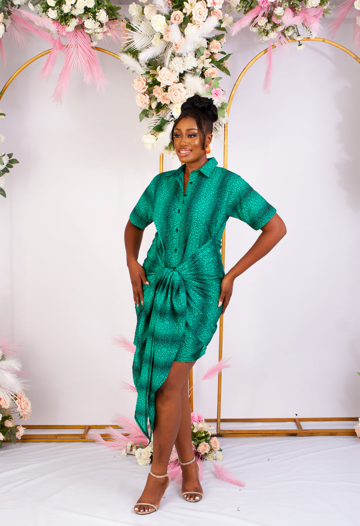 Green African Print Bodycon mini shirt dress perfect for a causal style. Short sleeve and front tie for an added edgy and chic look. Shop Ghana African print dress | African dress | African print Dress | African Clothing Online  Shop | Short African dress |  african women's clothing  | kitenge dresses | Africa Dresses for Women | African dresses for wedding | Danshiki Dress | Trendy African Dress | African clothing UK
