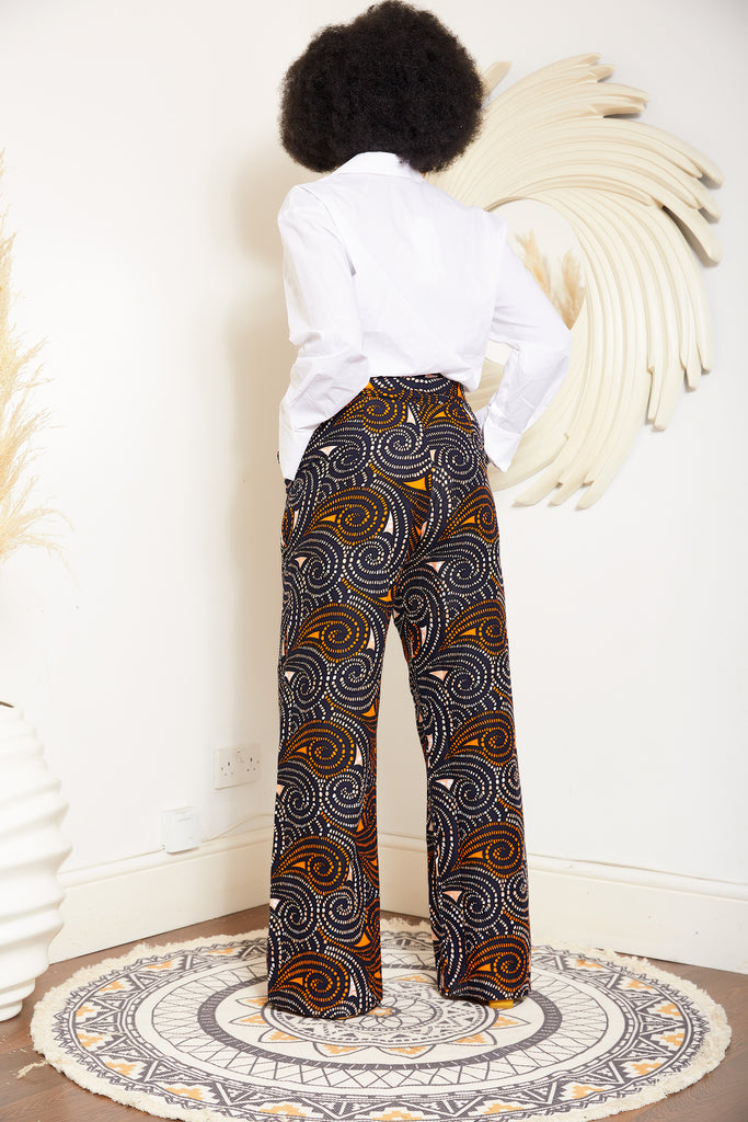 African print wide leg trousers | African print trousers UK | African print pants | African Print wide leg pants | African print clothing UK | Ready to wear African print pants | African Trouser styles | African clothing | African outfit | Ankara print  Trousers | Ankara pants for Women | Ankara Styles Trousers for ladies | African pallazo Trousers | Danshiki Trousers | High waist African print wide leg pants | African high waist pants| African loose fit Trousers | African print Trousers
