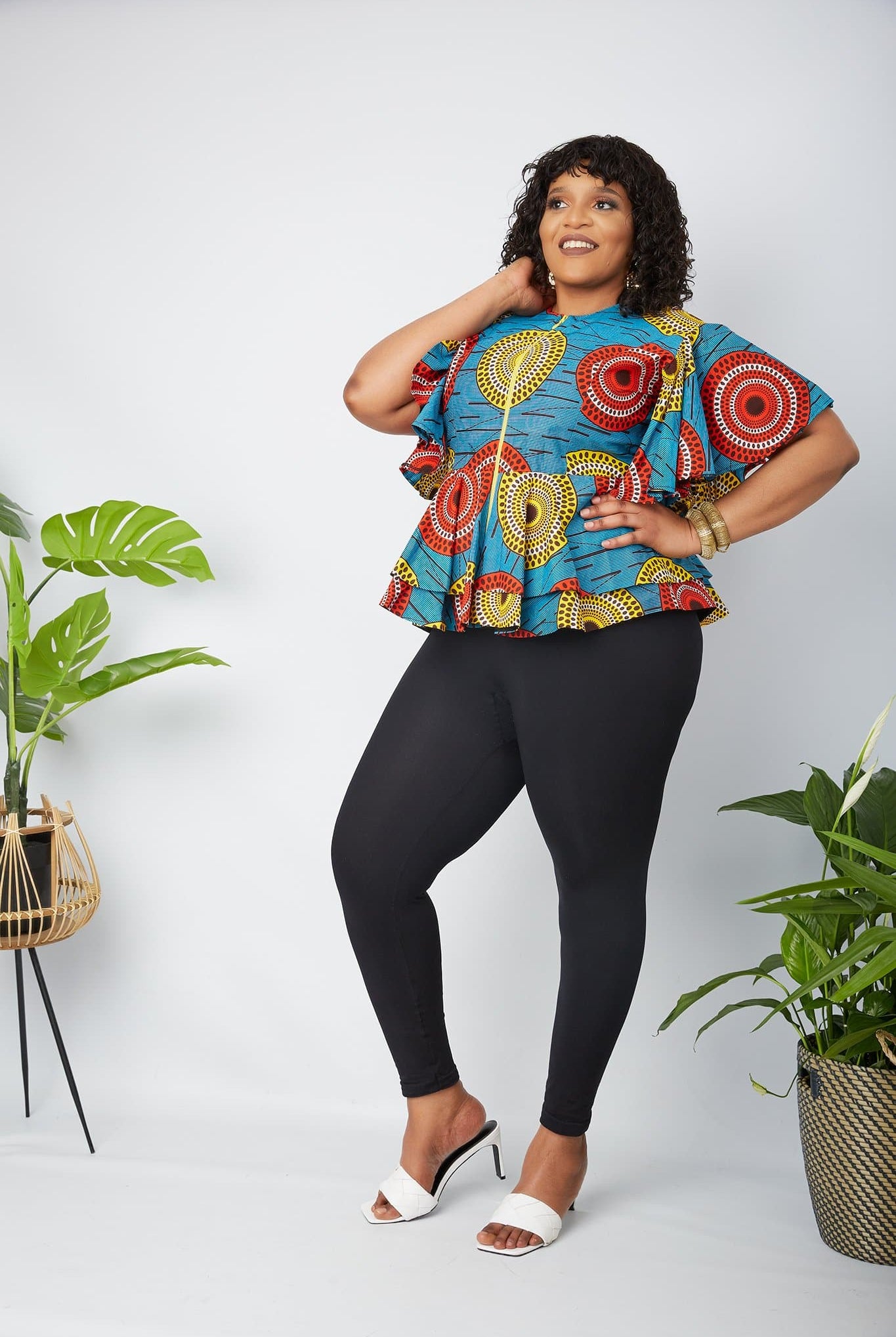Black owned African Clothing Brand in the UK. Discover Sustainable and ethical African Print apparel handmade by local artisans in Africa. Traditional African Print Wrap Top, African Print Crop Top, modern African Print Off Shoulder top, Danshiki Shirt, Plus Size African print blouse, matching African couples outfits